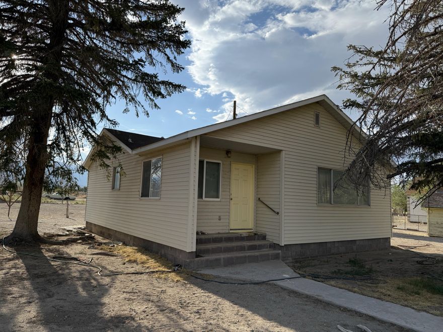 Just 13 miles from Great Basin National Park and Lehman Caves, and 3 miles from Pruess Lake, this 1950s home sits at the gateway to adventure: hiking, fishing, and some of the darkest night skies in the country. A true time capsule, it is sold fully furnished with every relic and treasure intact. A new 230' well delivers 2.6 EDUs of crystal-clear, cool drinking water—enough for another dwelling, a garden, animals, or to fuel your coffee habit for years. More than a retreat, it offers powerful nightly rental potential. Imagine welcoming weary travelers on their way to the park, stargazers seeking silence, anglers at the lake, or road-trippers chasing solitude.

With no nightly rental restrictions in Millard County, your options are wide open. Remote yet rewarding70+ miles to the nearest real stores in Ely, NV, Milford, UT, or Delta, UTyou'll find peace where wide open skies meet endless possibility. To get here, just drive to nowhere...keep going, then head straight into the middle of it. Buy this property, where life slows down and time stands still. Quiet nights are guaranteed. Live here. Retire here. Play here.