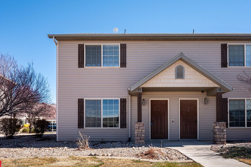 This budget-friendly townhome offers comfortable living in a highly convenient location. As an end unit, it provides added privacy and increased natural light, along with additional street parking. The main level features an inviting living room, spacious kitchen with dining area, half bath, and laundry room. Upstairs includes three bedrooms and two full baths, highlighted by a generously sized primary suite. Enjoy outdoor living on the fully fenced private patio, along with access to a large grassy common area, playground, and pavilion. Ideally located just off Main Street near the hospital and only five minutes from downtown Cedar City and Southern Utah University.  Now vacant and ready for a new owner to move-in or an investor to take over.