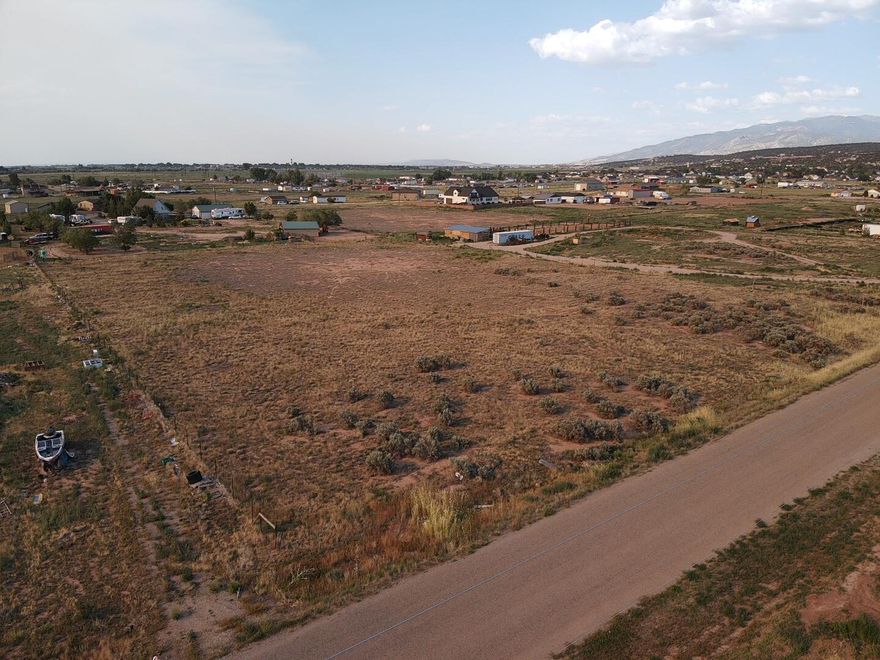 Discover an exceptional opportunity to build your dream home on this spacious 2.26 Acre nestled in a peaceful rural setting on the outskirts of Cedar City. Located in a growing area with mountain views and easy access to town, this level parcel offers plenty of room for a custom home, shop, or animals. The lot features open terrain, ideal for development, with utilities nearby. Enjoy quiet country living with no HOA and the freedom of wide open space, while still being close to shopping, and Highway 56 for commuting convenience. Whether you're looking to build now or invest for the future, this property is full of potential.