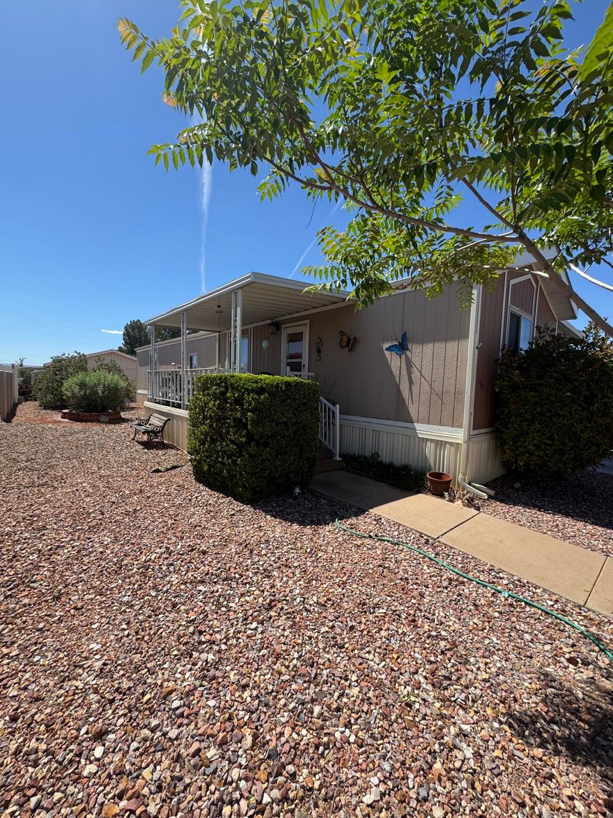 2-bedroom, 2-bath home in a quiet, private neighborhood on a RENTED LOT. This home is move-in ready. The primary suite includes a private bath and a full-sized closet. While the other bathroom is near the living space and the secondary bedroom. Drainage lines within the house have been replaced in the past seven years. The roof was replaced in 2020, and the home was painted. Enjoy a nice shaded sitting area, large covered parking, and a storage shed. - Buyer must be approved by the association to rent the lot.