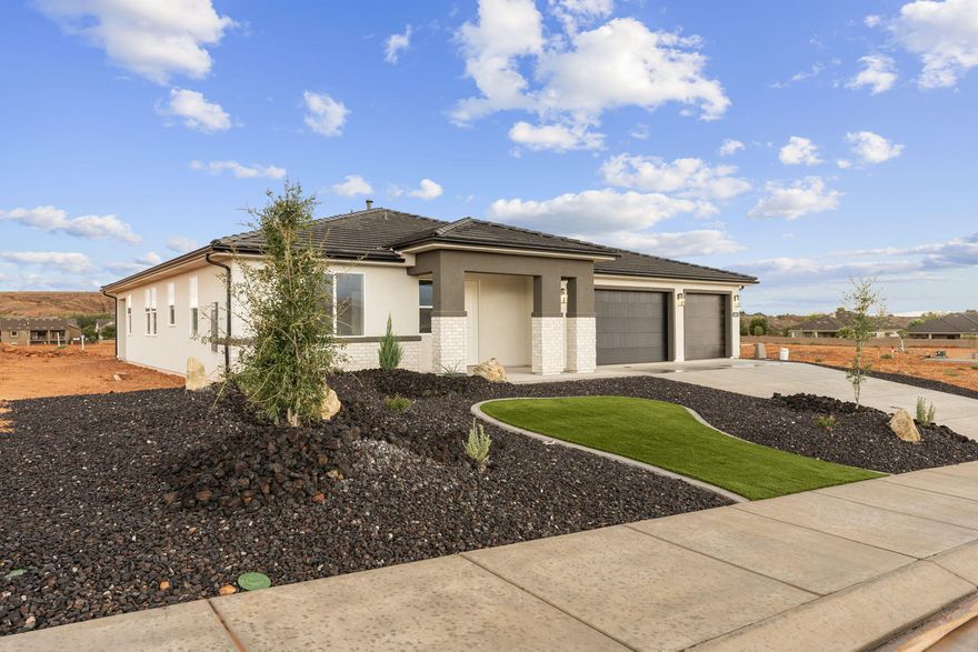 This beautiful fully finished 3-bedroom, 2.5-bathroom home in the scenic Sand Hollow area offers the perfect opportunity to own a thoughtfully designed residence by Holmes Homes. With modern finishes, open-concept living, and a 3-car garage, this home is ideal for full-time living, a second home, or a low-maintenance desert retreat. Located in the Dixie Heights community near Sand Hollow Reservoir, sand dunes, and award-winning golf, enjoy the best of Southern Utah's outdoor lifestyle—built just for you. Home just completed!