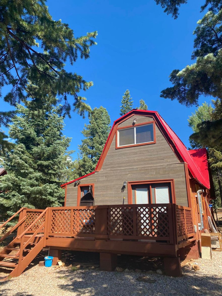 This charming 2-bedroom, 1-bathroom cabin in Duck Creek offers the perfect blend of comfort and convenience, with full utilities and year-round access. Currently operating as a well-established Airbnb, it's an excellent opportunity for both personal enjoyment and investment. The home features recent updates including fresh paint, a modernized kitchen, renovated bathrooms, and new carpet throughout, creating a clean and inviting interior. Step outside onto the spacious deck--perfect for BBQs, entertaining, and relaxing with family while enjoying the surrounding scenery. This cabin is truly a turnkey mountain retreat ready to enjoy in every season. 
Link to airbnb:
https://www.airbnb.com/rooms/44649997?unique_share_id=6efd9639-95b5-48ab-a06d-ba3a388a06cc&viralityEntryPoint=1&s=7
