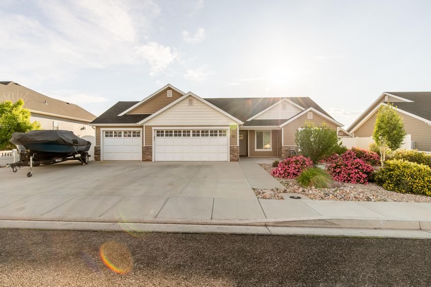 Discover this beautiful home in the sought-after Crescent Hills neighborhood! Featuring 3 bedrooms, 2 bathrooms, and 1,412 sq ft of thoughtfully designed living space, this home is loaded with extras-an extended 3-car garage, RV access and parking, and extra concrete in the backyard. The spacious, fully fenced yard is professionally landscaped and includes a covered patio with a gas bib-perfect for backyard BBQ's! Inside you'll love the extra large master suite and added cabinetry in the kitchen and living room for all your storage needs. And here's a bonus: the property is rentable, making it a great option for primary home or an investment!