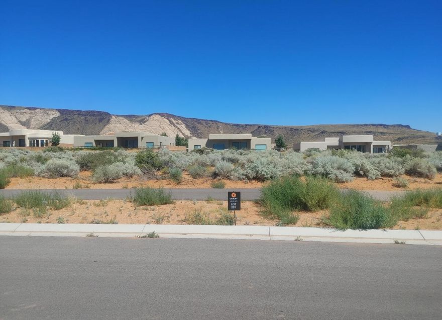 Large Custom lot in the scenic Ledges of Saint George Golf community. Great views of Snow Canyon State Park and Fishrock. Nearby public park including Pickleball. Bring your own builder!