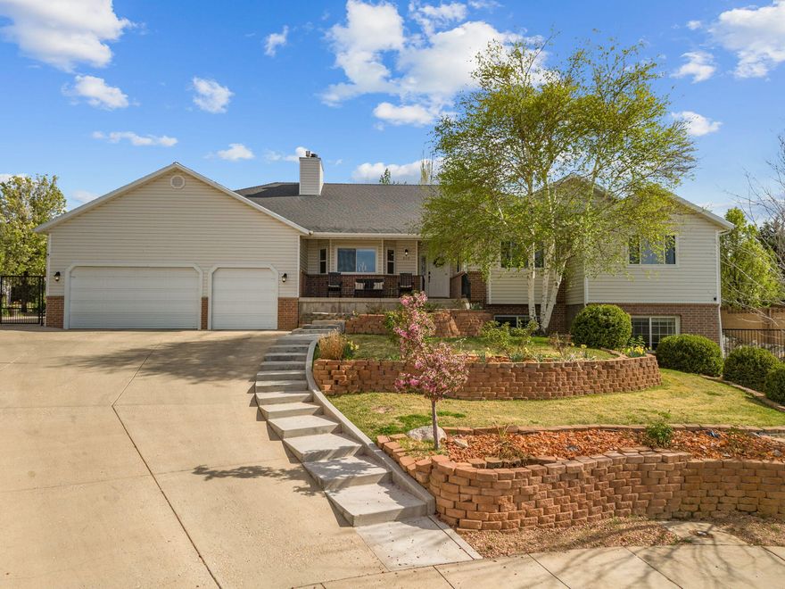 Welcome to this spacious 5,384 sq ft home located at the end of a quiet cul-de-sac in the desirable Legacy Park subdivision. Situated on a rare .53-acre lot, this 6-bedroom, 3-bath residence offers room to spread out both inside and out. The main level features generous updated living spaces, multiple fireplaces, and a functional layout ideal for everyday living and entertaining. The fully finished walk-out basement provides added flexibility with additional living areas and bedrooms, perfect for guests, renters, or multi-generational living. Enjoy a 3-car garage, RV access, full fencing, automatic sprinklers, and mature landscaping. Convenient Cedar City location close to schools, shopping, and I-15, and topped with elevated mountain views. This is a home you wont want to miss!