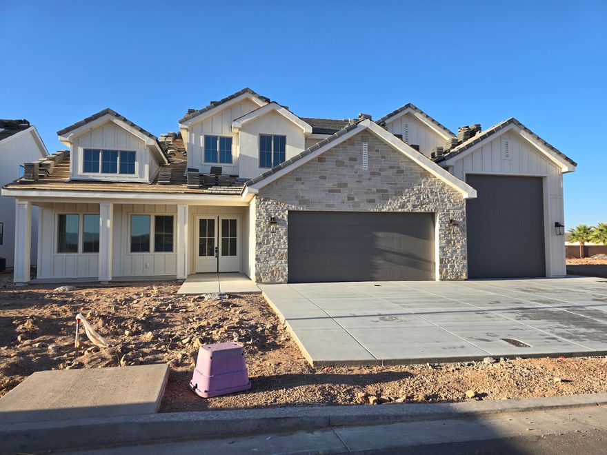 Brand new, gorgeous home built by B1 Builders. Detailed interior with beautiful finishes. Large butler's pantry, two dishwashers, two laundry rooms and a guest room on the main level.  RV Garage as well as RV Parking.  RV Garage measurements - about 34' deep, 15' wide with a 12'x13' garage door.  Full landscape and block walls on three sides included.