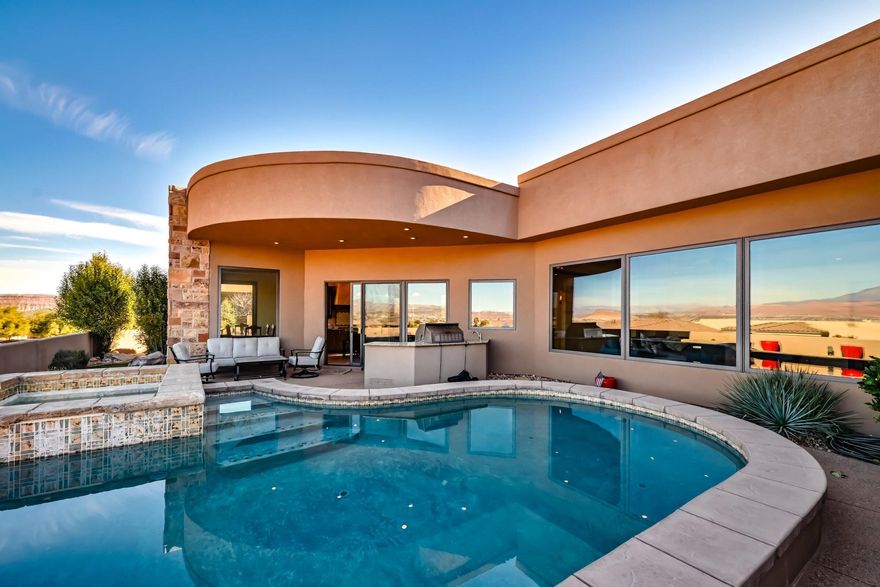 Relax and enjoy the pool and spa with the spectacular views of Pine Valley mountain or the evening lights of St. George and Washington. This Stone Cliff Custom built 4 bed, 4 bath, 3 car garage Tuscany style home is a must see if you are looking for your dream home in St. George. Perfect for the gourmet cook and entertaining family and guests well building memories enjoying the numerous amenities included.