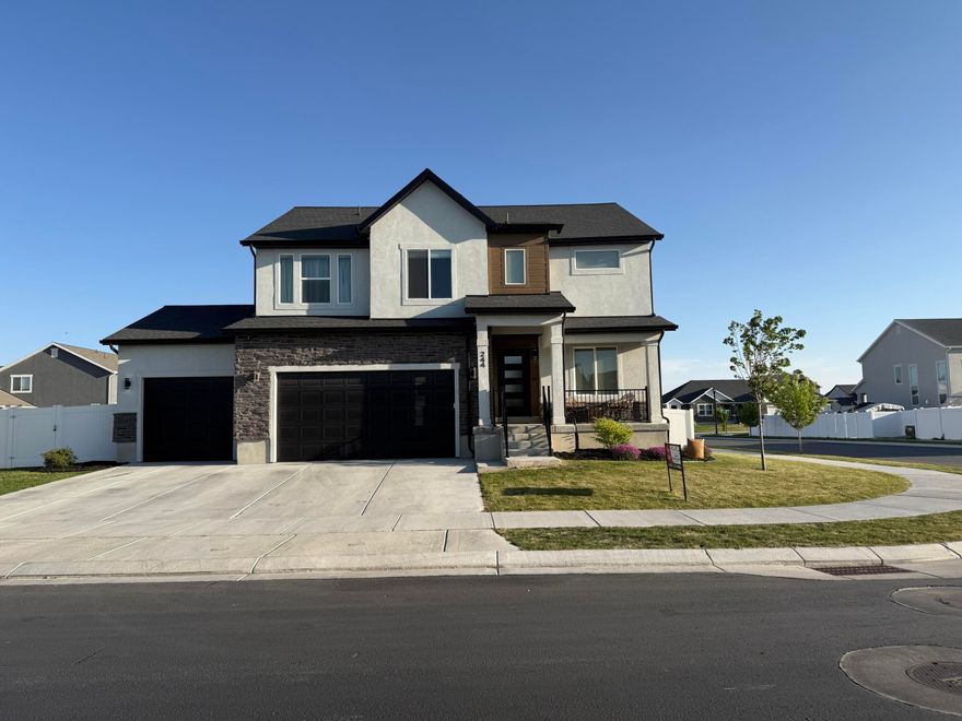 This BEAUTY is BACK ON the MARKET!  Featuring Contemporary Upgrades that outshine your Standard New Builds. ( Assumable 2.5% for qualified VA loan.) Your kitchen stands out with Sleek colored Appliances.  Offering custom features throughout: Vivint Security System stays (with your own plan), 
Soft water system modern shelving in several rooms, blinds stay,(curtains not included)
Upgraded Metal stair railing leading to a custom sitting room with plant wall on the 2nd level, basement is sound proofed and wired for surround sound, , Yes it has a third Car garage! In the back, a generous landscaped, corner lot, with a large covered patio.  Information is deemed reliable but not guaranteed.  Buyer to verify disclosures, courtesy square footage estimates obtained from county records.