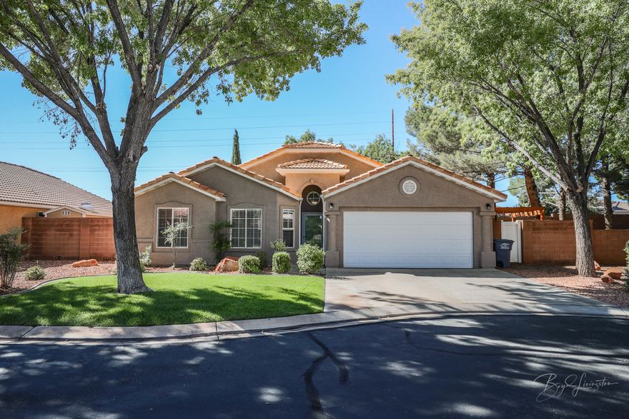 Charming home and neighborhood in Ivins.  Mature trees surround this 3 bdrm/2 bath single family home.  Split floor plan with open living/great room, separate laundry room and covered patio. The subdivision also has a small park for relaxing or walking the dogs.  LOW HOA fees cover front landscaping and small park.