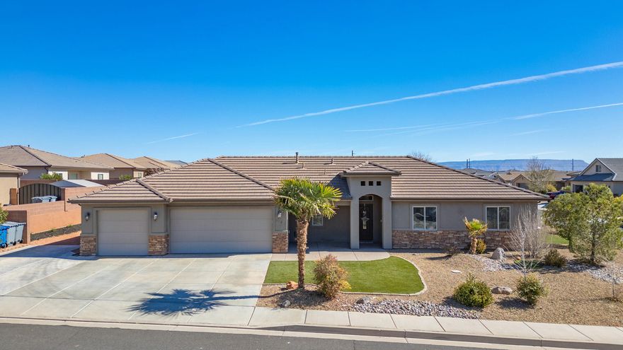 Fall in love with desert living at its finest. This immaculate 4-bedroom, 2-bath home has been meticulously maintained and truly shows like new. Offering the perfect balance of convenience and serenity. Perfectly situated near freeway access, premier shopping, and dining, you'll also enjoy breathtaking views of Southern Utah's iconic red mountains. Designed for low-maintenance living, the property features full artificial turf, RV parking, & a covered patio ideal for entertaining or unwinding. Bonus: the patio is plumbed for a hot tub, making stargazing nights even better. A rare opportunity you won't want to miss! Homes like this don't come around often!