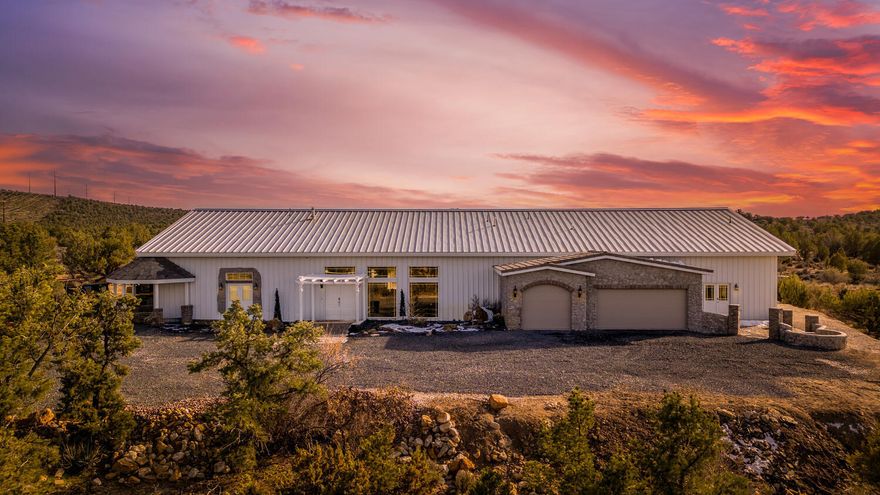 Hidden in the quiet expanse of Diamond Valley, this one-of-a-kind estate offers the kind of privacy, security, and flexibility that's increasingly hard to find. Set on 23.73 acres with rare OST-20 zoning, the possibilities here are truly infinite. 

Inside, natural light pours through oversized windows, illuminating soaring ceilings and wide-open living spaces designed for both comfort and entertaining. Enjoy a massive chef's kitchen complete with top of the line appliances, granite countertops, and an added pantry. Recent updates elevate the home's character, including refreshed brickwork, rich cedarwood ceilings in the kitchen, contemporary light fixtures, and fresh paint. 

The layout is ideal for both privacy and connection. Three spacious suites provide comfortable retreats, while separate two-bedroom casita apartment offers flexible space for guests, multigenerational living, or rental income.

The indoor pool area is a true standout - thoughtfully upgraded with 12-inch-thick insulation for efficiency and year-round comfort. The pool is heated and complemented by a separate kiddie pool, rope swing, and a 10-person spa, creating a resort-style sanctuary.

Built with solid steel construction, "durable" is an understatement for this home. It offers exceptional resistance to fire and natural elements. Energy-conscious features include solar power, passive solar design, a heat-reflective roof, geothermal cooling, a wood-burning stove, extensive storage areas, and a large cold storage space. Two shares of Diamond Valley water, high-speed internet, and an efficient septic system add practical value.

Nearly 24 acres offers room to breathe and the flexibility to dream - whether it's a boutique retreat, short-term rental, equestrian property, or private homestead. The property may also be subdivided into two A-10 parcels if desired.

Located near BLM land, just minutes from Snow Canyon and 20 minutes to town, with easy access to Tuacahn Amphitheatre and miles of hiking, biking, and ATV trails, this property delivers seclusion without isolation.

If you're seeking space, safety, versatility, and unforgettable desert sunsets under endless star-filled skies, this is a rare opportunity to own a private sanctuary in one of Southern Utah's most desirable settings.