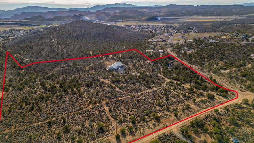 Hidden in the quiet expanse of Diamond Valley, this one-of-a-kind estate offers the kind of privacy, security, and flexibility that's increasingly hard to find. Set on 23.73 acres with rare OST-20 zoning, the possibilities here are truly infinite. 

Inside, natural light pours through oversized windows, illuminating soaring ceilings and wide-open living spaces designed for both comfort and entertaining. Enjoy a massive chef's kitchen complete with top of the line appliances, granite countertops, and an added pantry. Recent updates elevate the home's character, including refreshed brickwork, rich cedarwood ceilings in the kitchen, contemporary light fixtures, and fresh paint. 

The layout is ideal for both privacy and connection. Three spacious suites provide comfortable retreats, while separate two-bedroom casita apartment offers flexible space for guests, multigenerational living, or rental income.

The indoor pool area is a true standout - thoughtfully upgraded with 12-inch-thick insulation for efficiency and year-round comfort. The pool is heated and complemented by a separate kiddie pool, rope swing, and a 10-person spa, creating a resort-style sanctuary.

Built with solid steel construction, "durable" is an understatement for this home. It offers exceptional resistance to fire and natural elements. Energy-conscious features include solar power, passive solar design, a heat-reflective roof, geothermal cooling, a wood-burning stove, extensive storage areas, and a large cold storage space. Two shares of Diamond Valley water, high-speed internet, and an efficient septic system add practical value.

Nearly 24 acres offers room to breathe and the flexibility to dream - whether it's a boutique retreat, short-term rental, equestrian property, or private homestead. The property may also be subdivided into two A-10 parcels if desired.

Located near BLM land, just minutes from Snow Canyon and 20 minutes to town, with easy access to Tuacahn Amphitheatre and miles of hiking, biking, and ATV trails, this property delivers seclusion without isolation.

If you're seeking space, safety, versatility, and unforgettable desert sunsets under endless star-filled skies, this is a rare opportunity to own a private sanctuary in one of Southern Utah's most desirable settings.