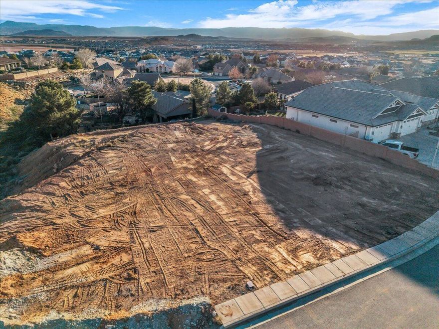 Prime View Lot in Majestic Sunset - Build Your Dream Home

This exceptional 0.45-acre homesite in the desirable Majestic Sunset subdivision offers a rare opportunity to create a custom residence in one of Washington's most scenic neighborhoods. Perched on an elevated, gently sloping lot, the property captures sweeping panoramic views of the surrounding valley, red rock mesas, and distant mountainsperfect for designing a home that maximizes outdoor living, sunsets, and natural beauty.

Located on a quiet street with established luxury homes nearby, it provides the ideal balance of privacy, prestige, and convenience, just minutes from schools, shopping, dining, and outdoor recreation.

Zoned for single-family residential, this parcel allows you the freedom to bring your own builder and create a truly personalized home. Buyers who choose to build with the preferred builder will receive special incentives on the construction, making this an even more attractive opportunity for those looking for a streamlined, cost-effective path to a high-quality custom build.

Whether you envision a modern desert retreat, a spacious family home, or a luxury estate with view decks and expansive windows, this lot provides the canvas to bring your vision to life in one of Southern Utah's most sought-after settings.