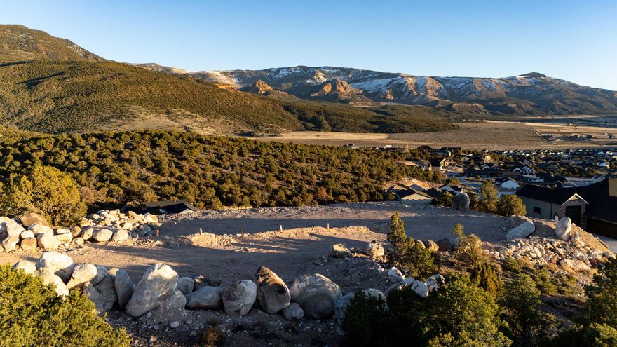 Quite simply the best building lot available in Cedar City right now - possibly ever! Two lots combined for over an acre in one of the most exclusive neighborhoods, with stunning 180 degree views of the mountains & Shurtz Cyn. Extensive grading and site prep is already done giving you a long driveway down to a building pad that feels perched on a high point in the neighborhood. Wide enough for an expansive home with views in every room, this gorgeous lot has utilities, & sits on quiet cul-de-sac. Giant boulders from the site have been used
to screen the lot from the street and line the driveway, providing the framework for future landscaping. Water meter to be set at the time of building permit, but water lines already run
through the site. DON'T WAIT - this is too special for you to miss!