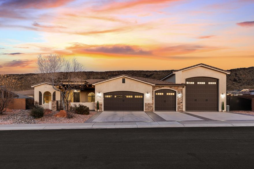 This single-level Dixie Springs home offers a functional layout, oversized lot, modern construction, and over 2,000 square feet of garage space, all designed for an active Southern Utah lifestyle. Built with both form and function in mind, the home centers around an open kitchen and living area with a fireplace, creating an easy, comfortable flow for everyday living and entertaining. Garage space is where this property truly stands out. In addition to an extra-deep three-car garage, large enough to accommodate a full-size crew cab Chevy 2500 with a tow hitch attached!! Plus an impressive 60' x 20' RV garage with a 14' x 14' door. Complete with hook-ups and sewer dump access both inside and outside, this space is built for far more than cars. There's room for boats, ATVs, adventure gear, and recreational vehiclesall at the same time. The property is also pre-wired with a dedicated 50-amp connection for a future pool and a second 50-amp connection for a jacuzzi, offering flexibility for outdoor living and future customization. Located just minutes from Sand Hollow Reservoir, Sand Hollow Golf Course, and surrounding trail systems, the home provides quick access to boating, off-roading, and outdoor recreation, while still offering a beautiful place to land between adventures. Set within one of Hurricane's most loved communities near Southern Utah's outdoor corridor, this home is ideal for those who want room for their toys and a truly comfortable place to call home.