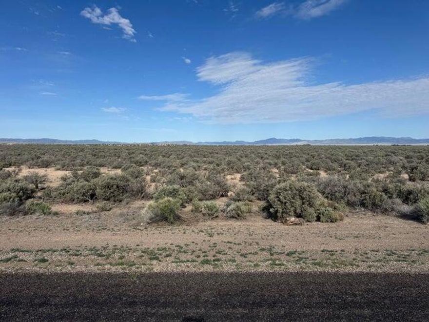 Seller Financing Available with 10% Down. Come own 28.50 acres rt on the corner of Beryl Hwy & 4000 N. Paved road along Beryl Hwy with easy year round access. Could potentially be rezoned for commercial use. Has 3 phase power on the corner of the property. This is two connecting parcels totaling 28.50 acres. Parcel 1 - #E-1306-0007-0000 18.50 Acres Parcel 2 - #E-1306-0004-0000 10.00 Acres Multiple uses might include residential or commercial. Build a home, build a cabin, bring your toys/trailers/campers/RV's & make it a family base camp. Close to Newcastle Reservoir, Enterprise Reservoir, Quick Access to Hamlin Valley Mountains. Only 20 min to Enterprise for food, grocery, gas, medical, dental, hardware, restaurants, schools. 50 min to St. George/Cedar City. Under 3 hours to Las Vegas.