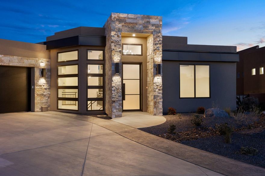 Modern 4-bed, 4-bath home with a walkout basement, located near Sand Hollow Resort. Enjoy sleek design, open living spaces, and stunning views in a prime location—perfect for relaxing or entertaining in Southern Utah's adventure hub.