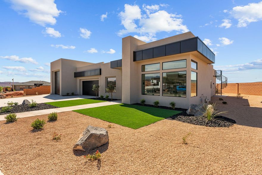 This home delivers where it counts--starting with a strong, functional kitchen featuring floor-to-ceiling cabinetry and premium Thermador appliances, all tied together with open space and 12' ceilings that make it feel right.

The primary suite is built to unwind, with a spa-like bedroom and bath that gives you the space and comfort you're after.

If you need a garage, this one shows up--a massive 18' x 48' RV garage with a 14' x 14' opening, plus extra room on the .32-acre lot for parking, toys, or future plans.

From there, you've got the extras: engineered hardwood floors, a scenic roof deck, solid Red Mountain views out front, and a backyard set up for late spring get-togethers. The 4th bedroom/office/casita has its own exterior entrance, making it a great fit for guests or a home-based business. All this and more awaits you. Come take a look!