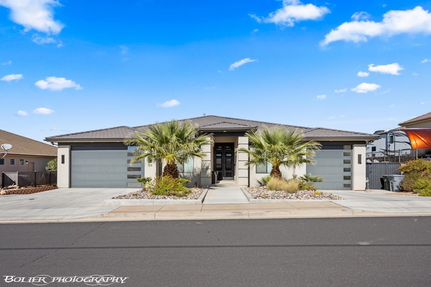 The perfect forever home, second home or investment property! 3 FULL kitchens with custom cabinetry and 3 laundry rooms. Includes a mother-in-law apartment on the main level with a private entrance, and handicap accessible. The Best Views in all of St. George. From the moment you step inside, the perfect combination of elegance and warmth will take your breath away. The open floor plan mixed with the unobstructed views will satisfy. Features 8 bedrooms, 7 full and 2 half bathrooms, The basement apartment includes 3 bedrooms and 2 bathrooms, super private. Stunning heated infinity pool and spa with misters and a fire pit, perfect for entertaining. All furniture and appliances are included!! (Artwork and statues are excluded). The main kitchen is complete with stainless steel appliances featuring double ovens, gas cooktop, an oversized island and a hidden pantry. Beautiful backlighting throughout the home. Large master bedroom, wake up to views of the mountains and city. Motion lights in master bathroom, custom closets. 12 ft ceilings on the main and 10 ft ceilings in bedrooms and basement. 2x6 construction all insulated, 4 separate systems for the HVAC! LVP flooring with weatherproof corkboard. Hidden vault in basement. Every interior wall very well insulated and sound proof. Pool equipment includes 4,000-gallon overflow, full automation with app. 7 car garages are extra width and depth, tons of shelving for storage. Plenty of parking for the family and guests. Enjoy the peaceful evenings and gorgeous sunsets. Views all of Snow Canyon, South Gate Golf Course, Tuacahn and Pine Valley Mountains! Fruit trees and garden boxes are perfect for your hobby if desired.