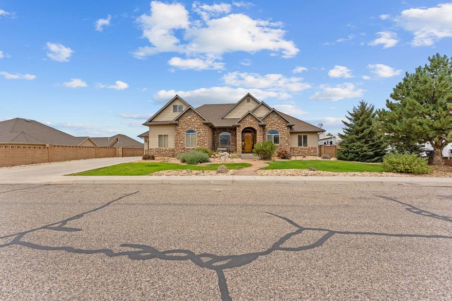 This large 6-bedroom, 3.5-bath home offers 4,846 sq ft of living space, perfect for families or anyone needing extra room. It features a large family room, an attached theater room for movie nights, and bonus space above the garage—great for an office, playroom, or storage. Located in beautiful Sunset Canyon Subdivision on a south facing lot.