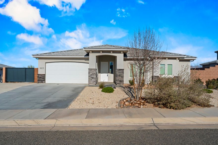 This stunning home combines modern living with unbeatable charm. Recently refreshed with a fresh coat of paint and new desert landscaping in the front, the home makes an excellent first impression and feels clean, updated, and move-in ready. Inside, brand-new carpet throughout adds to the fresh, inviting feel.

Boasting an open-concept design, the spacious kitchen features sleek white countertops and cabinets, a large pantry, and flows seamlessly into the generous living room—perfect for entertaining or everyday comfort. The large master suite offers a relaxing retreat.

Outside, enjoy the privacy of no back neighbors and a peaceful greenspace view, with plenty of room for kids to ride bikes along the backyard sidewalks or the opportunity to create your own garden with the diamond block retaining wall. The huge driveway provides ample parking, and the custom-built entertainment center adds a unique, personal touch.

This 2019-built home is low-maintenance and located in a tree-lined neighborhood with a strong sense of community, offering fun neighborhood events and convenient freeway access. Don't miss your chance to own a home that blends privacy, comfort, and an ideal location.