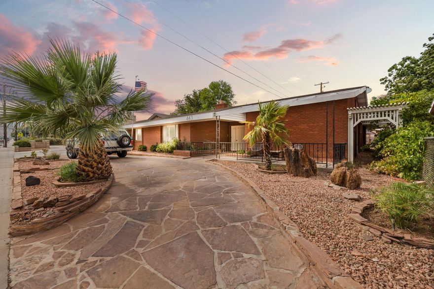 Conveniently located with easy access to Downtown St. George, this fully remodeled 1970's rambler offers exceptional flexibility for live/work use while still functioning beautifully as a comfortable everyday home. The adaptable layout includes 4 bedrooms plus a spacious den and living room. The updated kitchen shines with new appliances, custom cabinetry, a beverage bar, and an expansive walk-in pantry, while new flooring, plumbing fixtures, and a water heater run throughout, all thoughtfully balanced with original character like the sunken marble tub + modern dry sauna. Ample parking & spacious backyard add major value offering room for kids, hobbies & gardening. A versatile home in a highly accessible location. Ideal for those who want to live, work & grow in one dynamic space.