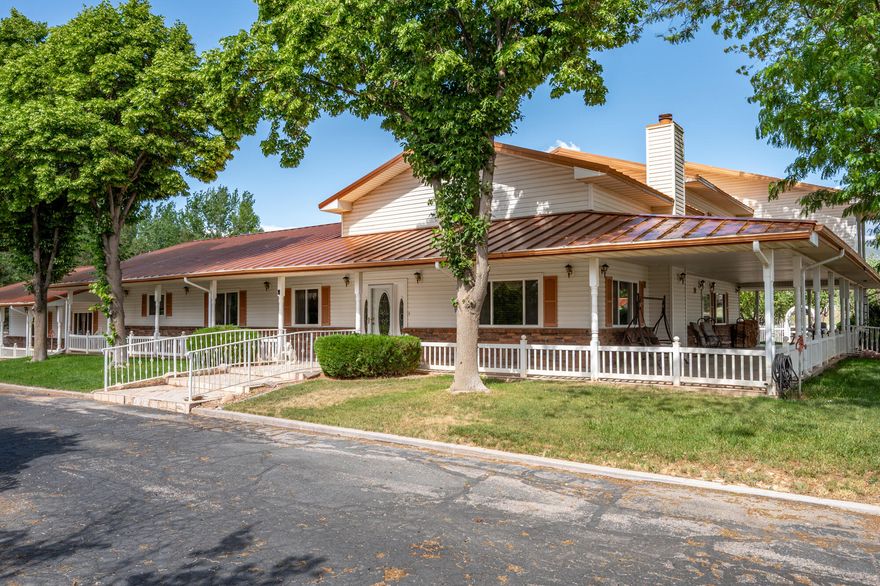 This classic home, set on an expansive 2.92-acre lot, offers 3,104 square feet of living space, featuring 3 bedrooms, an office, and 3.5 bathrooms. As you walk inside, the home welcomes you with an open living area featuring a cozy fireplace and plenty of room for family. The main floor includes a kitchen with marble counter tops, solid oak cabinets with pull out shelves in all the lower cabinets and is already plumbed for a stand-alone ice maker! You'll also find the dining room, office, laundry room, and half bathroom, along with two bedrooms, each with their own full bathroom. Upstairs, the loft area houses the master bedroom, which offers access to a deck and a spacious bathroom with a jacuzzi tub and a glass block walk-in shower. The property includes a 3-car attached garage and a sizable 2,925 square foot RV garage/shop that will accommodate a 45ft motorhome. The shop comes with 2 RV hookups, a 1-bedroom, 1-bathroom apartment and an upstairs storage area with a washer and dryer for the apartment. Additionally, there is a 5-car garage measuring 75 x 24 feet, a well house, a storage shed, and a charming fruit orchard that includes apples, peaches, plums and cherries. The covered porch comes equipped with an outdoor BBQ, furniture and a beautiful view. The yard holds two ponds with spill over fountains for fish and is completely fenced with a double automatic gate for entry! Take care of the lawn with a riding lawn mower that includes every attachment you could need to mow, apply fertilizer and weed killer. The owner's annual water expense is approximately $500 and the home is HOA free! Boat can be included if interested. Please reach out for any questions!