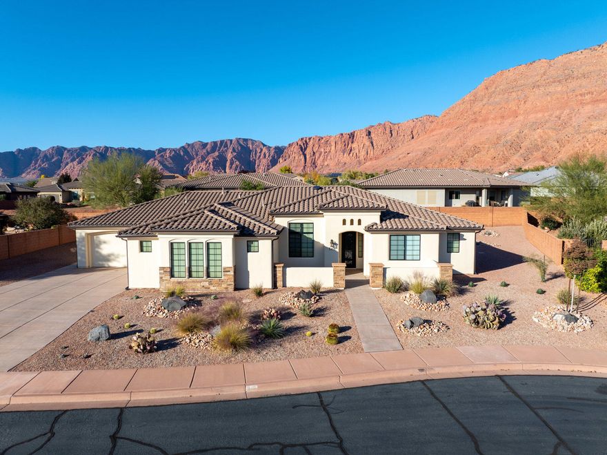 Enjoy beautiful Red Mountain views from the covered patio or courtyard of this immaculate 4-bed, 3-bath home. It features a gourmet kitchen with premium cabinetry and double-thick granite, water softener, central vacuum, monitored security system, surround sound (including patio speakers), Control4 smart-home technology, and added R-50 insulation. The newly painted exterior, xeriscape landscaping, and epoxy-coated 4-car garage—with abundant built-in storage—ensure low-maintenance living. No HOA and space to add a pool and RV pad.  There are select furnishings available for purchase. This property blends luxury, functionality, and flexibility in one exceptional package!