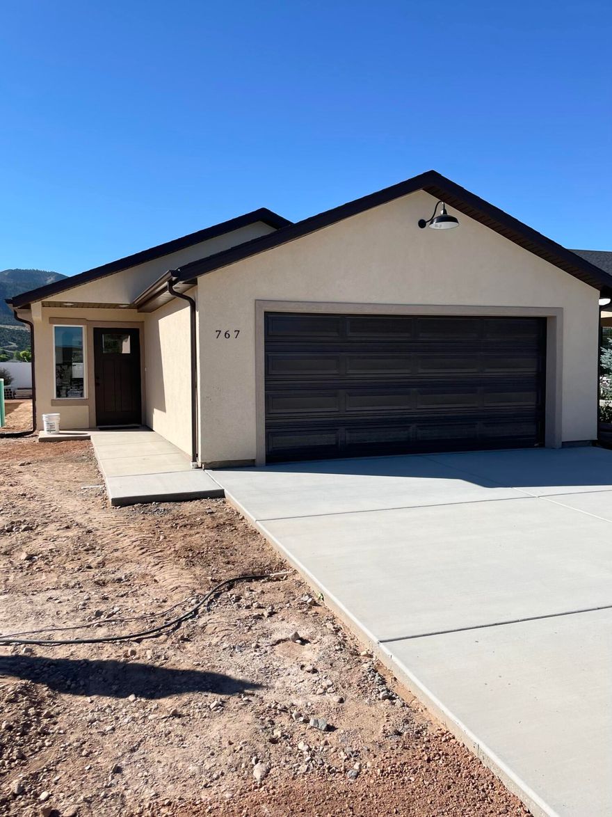 Brand new and beautifully finished, this 3-bedroom, 2-bath home offers an open, inviting floorplan perfect for modern living. Located on a quiet cul-de-sac in the charming town of Parowan, you'll enjoy peaceful surroundings with small-town appeal. The home features durable LVP flooring, quality finishes, and thoughtful extras throughout. Spacious living areas flow seamlessly into the kitchen and dining, making it ideal for entertaining or everyday comfort. A two-car garage adds convenience and storage. Homes will be ready soon, a must-see!