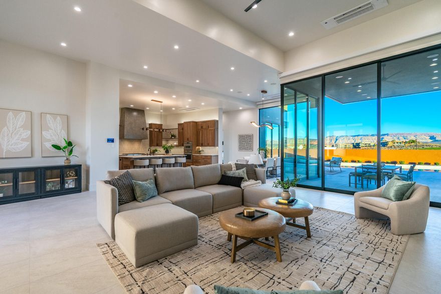 Located in the prestigious Estates at Sand Hollow Resort, this luxury residence offers refined design and resort-style living. The home features 4 spacious bedrooms, each with a private en-suite, plus a half bath and dedicated pool bath for added comfort and privacy. The chef's kitchen showcases Thermador appliances and high-end finishes, ideal for everyday living and entertaining. Automated systems and motorized blinds add modern convenience. Designed for seamless indoor-outdoor living, the property features a pool, hot tub, outdoor grill burner, vented hood, and misting system—perfect for enjoying the desert lifestyle. perfect for year-round enjoyment.
Designed for the lifestyle, the property includes an fully insulated  oversized boat garage and a two-car garage, providing ample space for recreational vehicles, storage, and adventure gear. 

View corridors are thoughtfully integrated to preserve sightlines and enhance long-term value, allowing the home to capture surrounding desert views while maintaining privacy and architectural integrity within the community. This home seamlessly blends luxury, comfort, and lifestyle in one of Southern Utah's most sought-after resort communities.