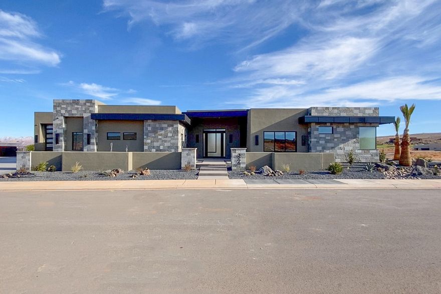 Located within the prestigious Estates at Sand Hollow Resort, this exceptional luxury residence offers refined design, thoughtful functionality, and resort-style living at its best. The home features four spacious bedrooms, each with a private en-suite, along with a half bath and dedicated pool bath, creating comfort and privacy for owners and guests alike.
Luxury upgrades are found throughout, anchored by a chef's kitchen equipped with Thermador appliances and high-end finishes designed for both everyday living and entertaining. Automated systems and automatic blinds add modern convenience and clean architectural lines. Designed for effortless indoor-outdoor living, the property features a pool and hot tub along with an outdoor grill burner, vented hood, and misting system— perfect for year-round enjoyment.
Designed for the lifestyle, the property includes an fully insulated  oversized boat garage and a two-car garage, providing ample space for recreational vehicles, storage, and adventure gear. 

View corridors are thoughtfully integrated to preserve sightlines and enhance long-term value, allowing the home to capture surrounding desert views while maintaining privacy and architectural integrity within the community. This home seamlessly blends luxury, comfort, and lifestyle in one of Southern Utah's most sought-after resort communities.