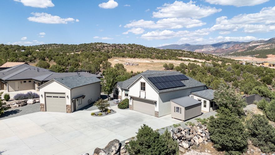 **REDUCED $60,000** Top of the hill views, gorgeous outdoor living space, detached RV garage, solar panels -this home has it all - but NO HOA! Best locations and neighborhoods, this beautiful home is quite literally on a hill overlooking the South Mountain area & Shurtz Canyon. It has a 3/4 enclosed back patio that is protected from the elements doubling as an outdoor living & entertaining area overlooking views, garden, firepit, & waterfall. Most space is on the main level with only 532 sq ft up; this space makes 5 or 6 bedrooms depending on how you use it, its a great office suite or studio w/its wall of built-in storage and ensuite bathroom. The other amazing feature is the 700 sq ft detached RV garage, which is fully insulated, w/wall heaters, 220 power, built-in storage & workshop.