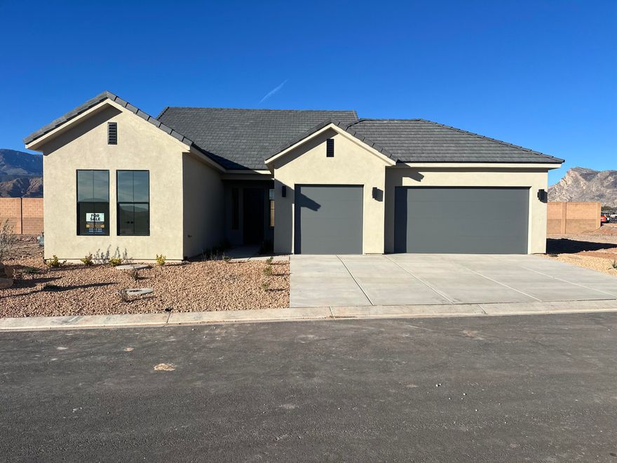 This brand new home will be ready for move in by Christmas!! This new SunRiver community is just West of Toquerville and will have over 1,200 homes and the amenities and lifestyle that SunRiver is famous for. 1st phase of amenities breaking ground in late 2025 and ready for use late 2026. This home is the Hamlet spec home with over $67K in design upgrades and comes fully landscaped with oversized 3 car gargage. No HOA for first 2 years after closing to Founders Club (first 74 homes.) Visit www.sunriver.com to see all the details. Buy now and get larger homesites close to amenity. This home qualifies for HECM purchase, as low as $339,900 down with no mortgage payment if over 62 years old, for qualified borrowers.