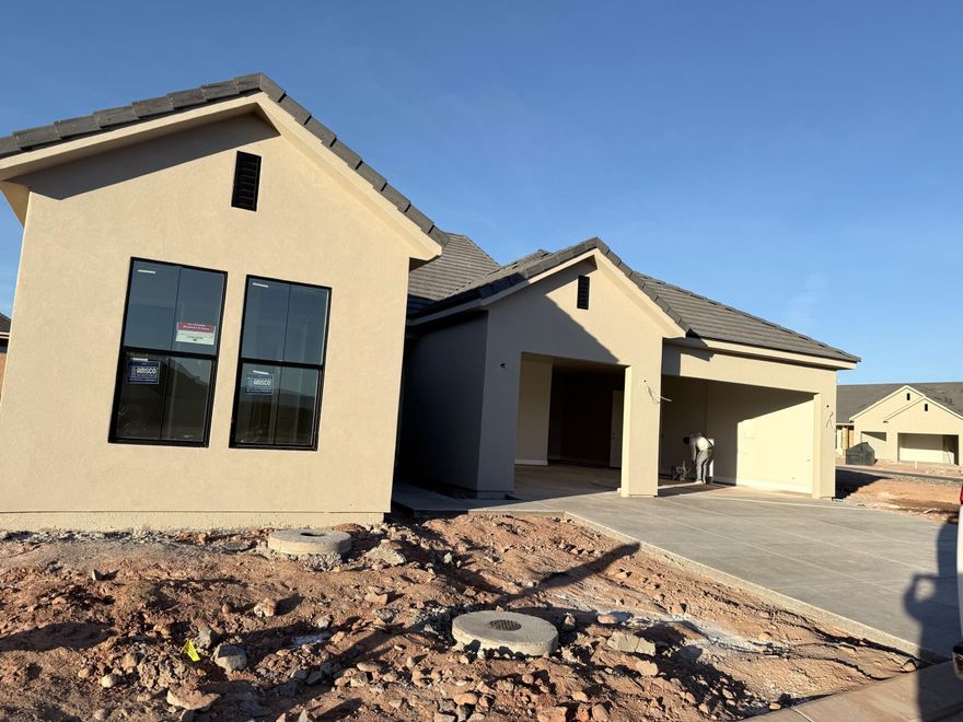 This brand new home will be ready for move in by Christmas!! This new SunRiver community is just West of Toquerville and will have over 1,200 homes and the amenities and lifestyle that SunRiver is famous for. 1st phase of amenities breaking ground in late 2025 and ready for use late 2026. This home is the Hamlet spec home with over $67K in design upgrades and comes fully landscaped. No HOA for first 2 years after closing to Founders Club (first 74 homes.) Visit www.sunriver.com to see all the details. Buy now and get larger homesites close to amenity. This home qualifies for HECM purchase, as low as $339,900 down with no mortgage payment if over 62 years old, for qualified borrowers.
