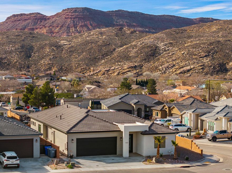 Stunning Views! Wake up to sunrise lighting the mountains and wide-open skies--elevated above the neighborhood on a premier corner lot. This custom home is part of the exclusive Builder's Reserve, the final phase of Zions Gate Estates. Oversized windows frame the scenery and flood the home with natural light, while evenings are made for the covered patio and gas fire pit. Inside you'll find floor-to-ceiling kitchen cabinetry, designer finishes, spacious rooms, and striking tilework. Pre-wired for hot tub and RV. The 24' deep garage fits a full-size 4-door pickup. No HOA. One-year builder warranty. Seller is a real estate licensee.