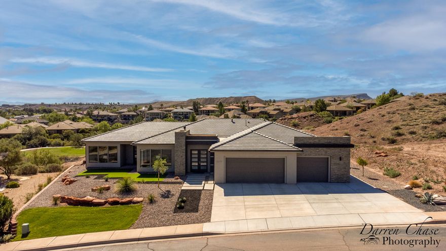 VIEWS VIEWS VIEWS! You've found the VIEWS you've been waiting for. Perfectly positioned above Sunbrook Woodridge Hole #3, this stunning custom home captures breathtaking 360Â° views of the golf course, surrounding landscape, and vibrant Southern Utah skies from nearly every room. Meticulously maintained with high-end appliances, induction cooktop, 8' solid wood doors, automatic blinds, rift oak cabinetry and flooring, plus five sheer walls, walk in butler pantry, and . Soundproof room, wired for a hot tub, and move-in ready. Luxury living with unforgettable VIEWS.