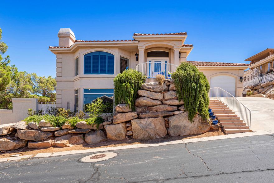 Views! Views! Views!  You've got to come see the view from this beautiful home atop the Bloomington Hills Golf Course and look across the whole valley!  With views of St. George and Pine mountain you'll be able to create a backyard oasis on this double lot!  
Walkout basement entrance, huge mature trees for shading, endless possibilities in the backyard.  Existing pool and backyard in the middle of refurbishment. The home is super clean and well maintained.  Located near shopping and medical, yet far enough away to enjoy peace and quiet in your tranquil backyard.  
Call now to schedule a showing.