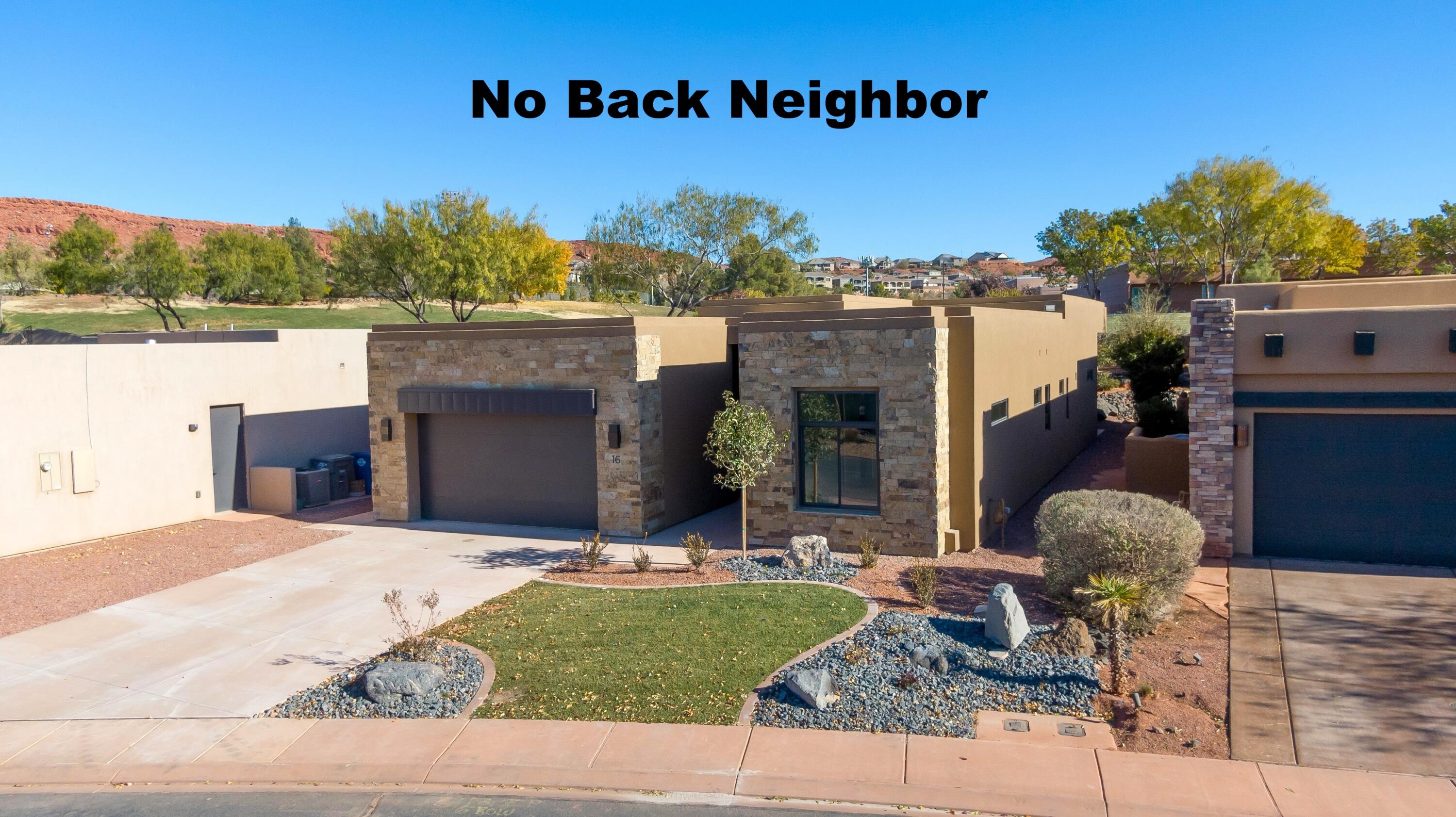 Brand New & No Back Neighbor!
Looking for a place near the stunning red cliffs of Snow Canyon Stake Park? Enjoy walking or biking to the park on the beautiful trail system that runs from your doorstep & extends throughout the county, offering endless outdoor exploration.
Located in a gated community adjacent to Entrada, this home is just a stone's throw away from the Black Desert Golf Course. You'll also find The Canyons Softball Complex & the new Digby's Market just out your back door.
The HOA dues are just $200, which covers yard care, the community pool, hot tub, private roads, & gate access.
The interior offers neutral colors & modern design. Extra tall ceilings create a sense of spaciousness & grandeur. Since there's no rear neighbor, the backyard is exceptionally private.