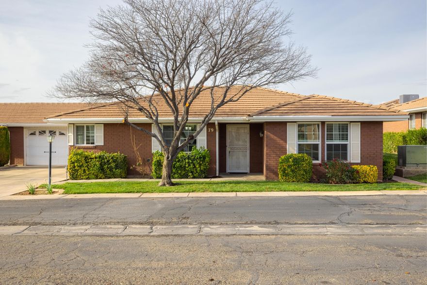 This is one of the best locations in St. George. This single-level 2-bedroom, 2-bath brick townhome features a 2-car garage with an electric vehicle charger, new energy-efficient windows, and includes the washer, dryer, and refrigerator. Just blocks from the hospital and minutes from shopping and groceries, this non-55+ community is perfect for first-time homeowners, investors, or a second home base. Enjoy easy access to everything Southern Utah has to offer—from national parks and Tuacahn to biking, hiking, arts, and sports—all right outside your door. Also enjoy your own community pool and clubhouse. This is the ONE! Schedule a showing and start enjoying the warm weather of southern Utah.