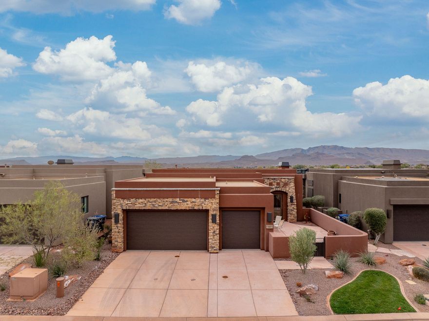Luxury living meets iconic Southern Utah scenery at Escapes at Entrada in this beautifully designed retreat. Featuring 3 spacious bedrooms and 3.5 bathrooms across 1,997 square feet, this home offers a thoughtful layout focused on comfort, privacy, and effortless entertaining. A large front courtyard creates a stunning arrival and a private outdoor space ideal for relaxing or hosting guests.

Take in breathtaking red rock and Snow Canyon views that showcase the very best of the desert landscape. The 2.5-car garage provides plenty of room for vehicles, storage, and recreational gear. Located within the prestigious Escapes at Entrada community, this home delivers an exceptional blend of luxury, scenery, and lifestyle.