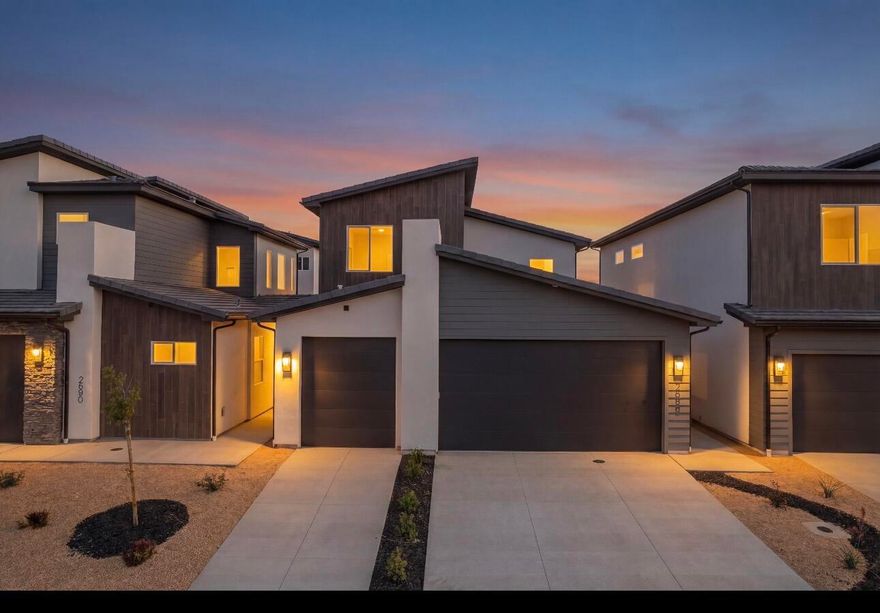 Luxury townhome located at The Front 9 at Sky Mountain with main-level living and a rare third-car garage. The primary suite, laundry, kitchen, and great room are all on the main floor for easy day-to-day living. Enjoy a private interior courtyard plus an enclosed backyard with a dedicated 220V outlet ready for your personal hot tub. The great room soars to over 19 feet, bringing in natural light and an open, airy feel. Upstairs adds three guest bedrooms, a full bath, and a second living area for work, play, or guests. The HOA covers exterior maintenance and insurance, and your amenities package included in this purchase includes access to the community pool, hot tub, and pickleball courts. Buyer to verify all information, including HOA coverage and inclusions. Call today to set up a showing.