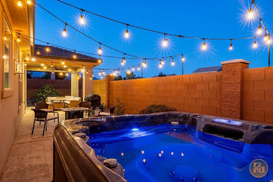 Evenings here start in your private hot tub under string lights. Mornings start with coffee on the covered patio before a bike ride to the trails or a short drive to Zion. This is the kind of home that's easy to love -- and even easier to leave, because the HOA takes care of everything outside while you're gone.
Inside, the layout is wide open and easy to live in -- the kind of space where the kitchen stays part of the conversation while dinner is being made, and the living room feels just as good with a full house as it does with just two. The primary suite is a proper retreat, with a soaking tub, walk-in shower, and walk-in closet. The third bedroom is set up as a bunk room -- ideal for kids, guests, or maximizing rental nights.
Step outside and the backyard delivers: a covered patio, fire pit seating area, and a private hot tub glowing under string lights after dark. The HOA takes it further with a resort-style community pool, spa, splash pad, park, and lighted pickleball courts -- all maintained for you.
STR-zoned and investor-friendly. Minutes from Sand Hollow, Quail Creek, Snow Canyon, and Zion. Available with the option to purchase fully furnished -- everything in place from day one, no coordination required.