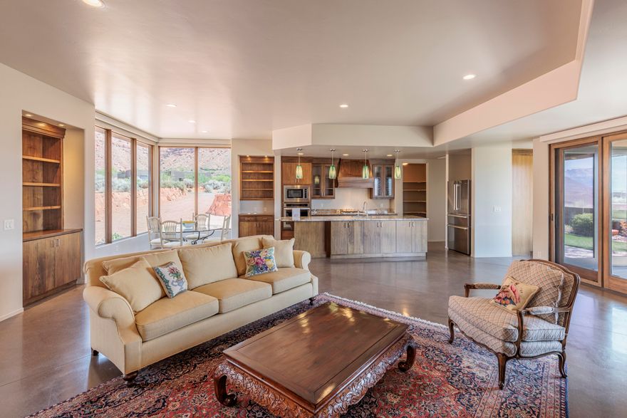 This gorgeous Kayenta home is located in the Taviawk area of Kayenta, and has the jaw dropping Red Mountain views that Kayenta is known for. The home sits on nearly one acre, and has been immaculately maintained. Stunning concrete floors throughout, with ample storage areas, 3 bedrooms and 2 bathrooms. Oversized 2-car garage, contemporary modern automatic blinds, solar panels and water softener are included. This quiet, secluded  home, with it's excellent views is a must see!