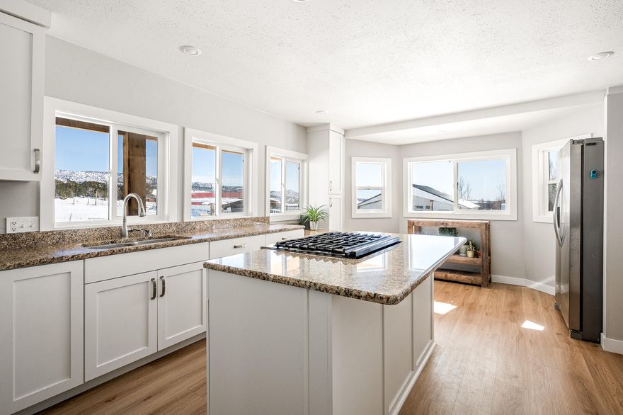 Property sale to include parcel A-B-25-1C. Home located in charming Alton, Utah! This beautiful home sits on nearly three acres, perfect for those with a love for horses, gardening, or simply enjoying the expansive natural surroundings. With less than 120 neighbors, Alton offers a quiet lifestyle for those who want a city escape. The 1,575-square-foot residence is designed for comfort, featuring two bedrooms, one and a half bathrooms, a sun-filled kitchen with granite countertops and a versatile area upstairs. Cool the home with mini split A/Cs and use propane or the wood stove for heat. Outside includes a porch with beautiful saw-milled beams, abundant storage with two outbuildings and a secure 192sqft Conex container For water, the property has 2 water meters and 4 water spigots. Venture outside for endless hiking and exploration adventures, making this property a rare and peaceful retreat.