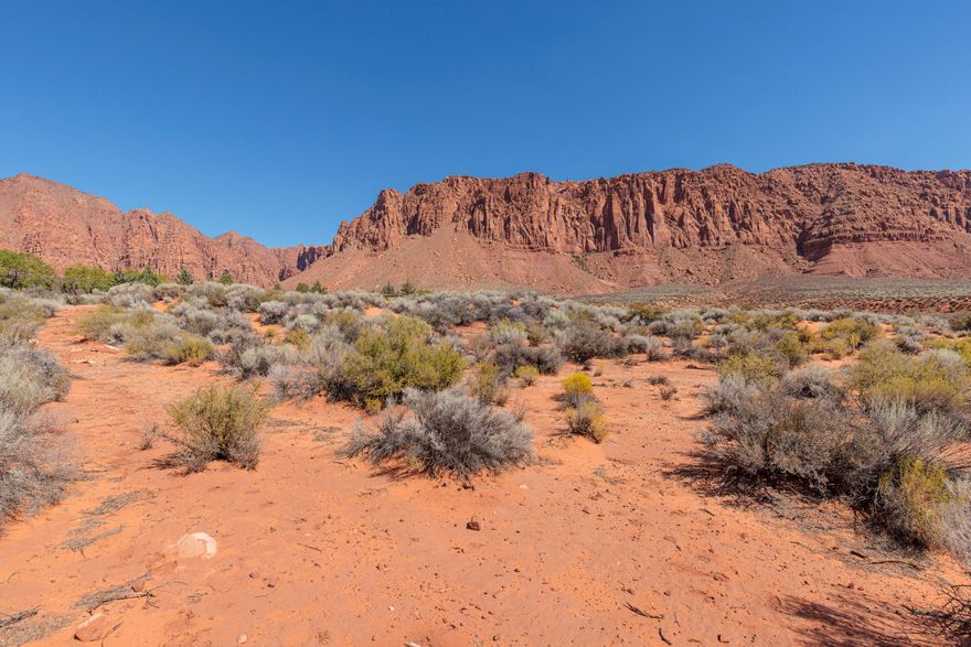 Don't miss the opportunity to own one of the largest and most and dramatic lots remaining in southern Utah's premiere desert community.  This prestigious and private 2.62 acre estate-sized lot is perched on the edge of the Kayenta Wash at the end of a secluded cut-de-sac and offers awe-inspiring and unobstructed views of towering red cliffs, expansive sagebrush and seasonal waterfalls.  Enjoy living in a ''national-park-like'' setting.  Stunning sunsets, protected night skies, and just 5 minutes to the cultural, gastronomic, and retail offerings of the renowned Kayenta Art Village.  Come see this amazing lot and envision yourself embracing and thriving in the Kayenta lifestyle.