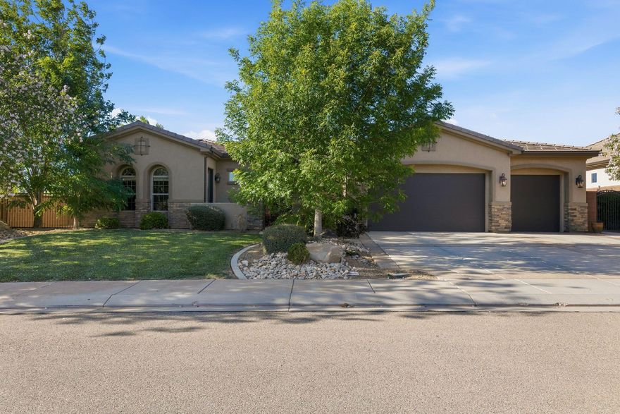 Custom-built 2015 home on .27 acres in The Meadows at Stucki Farms -- fully landscaped and designed around the views. Walls of windows frame Pine Valley Mountain, Warner Valley Ridge, and the hot air balloons that rise from Staheli Farms nearly every morning. This isn't a backdrop you get used to -- it takes your breath away every single time.
Inside, knotty alder cabinetry, granite countertops, wood-look tile floors, and a floor-to-ceiling rock fireplace with rustic beam mantel. French doors open to a third bedroom or use it as a dedicated home office. Two full primary en-suites offer rare flexibility -- one features a private exterior entrance from the gated courtyard, perfect for multigenerational living or a guest retreat. 3-car garage with storage.

Stucki Farms amenities include 4 pools, pickleball courts, a 5-acre park with pavilion, playground, basketball, picnic areas, and discounted mini golf. Community living with custom-home quality.