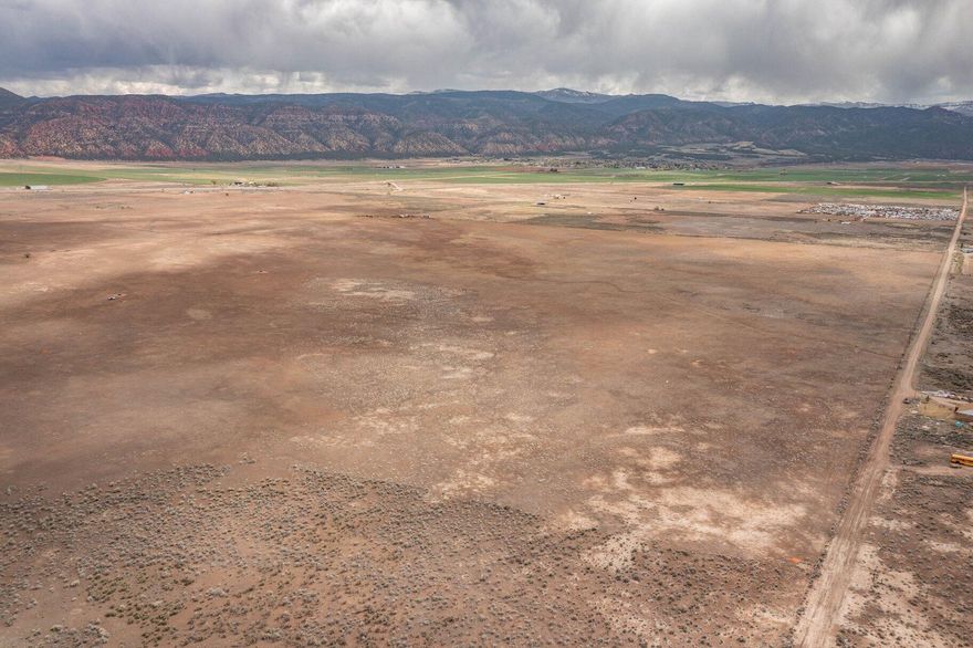 Remarkable opportunity to own a 20-acre parcel just off exit 82 on i-15 for Paragonah. With stunning mountain views and ready for you to build your perfect oasis. Zoned as A-20. Each lot comes with 1 acre-feet of water right. Parowan is an incredibly beautiful small town of just over 3,000 residents. Close to Cedar City, which is home to Southern Utah University, and the Shakespeare Festival, as well as some amazing restaurants. As part of Southern Utah, you will experience a lifestyle like no other. The area features nearby internationally recognized mountain biking trails, road cycling, hiking, golf courses, national parks such as the Grand Canyon, Zion, & Bryce, plus national moments, national forest, reservoirs, & some of the most iconic desert landscape in the world. Less than 30 minutes from Brian Head Ski Resort, there is no doubt that this is a fun place to live and play.  

All information herein is deemed reliable but is not guaranteed. Buyer is responsible to verify all listing information, including square feet/acreage, to buyer's own satisfaction.