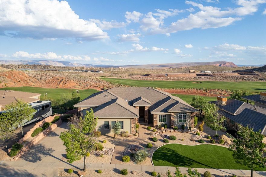 Set along the fairways of holes #9 and #1 of Coral Canyon Golf Course, this home captures wide, open views and a level of privacy that's hard to find.

The layout is designed with flexibility in mind, offering 7 bedrooms, 5 of which feature private ensuites--ideal for hosting, multi-generational living, or giving everyone their own space. The walk-out basement includes a second full kitchen, creating ease for entertaining or offering the option for separate living areas without sacrificing connection throughout the home.

Inside, the home feels both open and inviting, with tall ceilings and expansive windows that bring in natural light and frame the surrounding views. The spaces are thoughtfully designed with room to gather as well as unwind, while a dedicated home theater adds the perfect setting for movie nights or game days.

Outdoors is where this property truly stands apart. The backyard opens directly to the course and has been carefully designed to take full advantage of the setting--featuring an infinity-edge pool and spa, private putting green, and multiple firepit areas that make it easy to enjoy year-round.