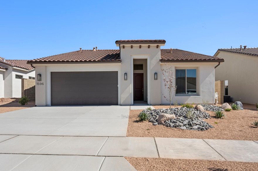 Discover the Mojave floor plan, a thoughtfully designed home offering 3 bedrooms and 2 bathrooms within 1,840 square feet of elegant living space. With tall ceilings and a spacious side patio just off the kitchen, this home maximizes your indoor and outdoor dining experience. The contemporary kitchen features optional gourmet enhancements, while the primary suite boasts a luxurious ensuite bathroom. Embrace the vibrant lifestyle in the Solis community, where resort-style amenities elevate your everyday living.