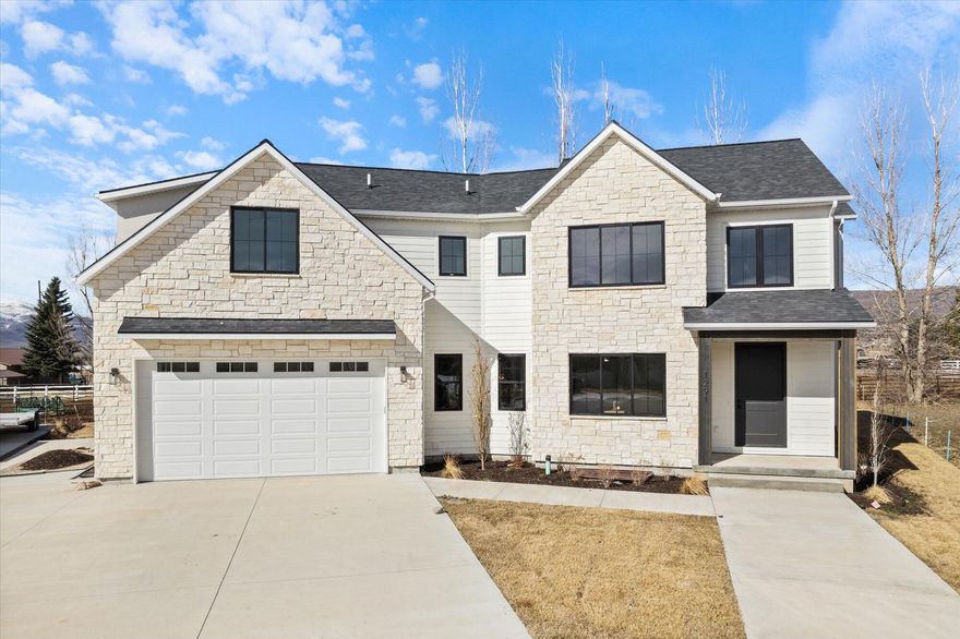 Discover this stunning brand-new, beautifully crafted home in the heart of Heber City, offering breathtaking mountain views and the charm of a peaceful small-town setting. Nestled in a quiet cul-de-sac, this 6-bedroom, 5-bathroom home is thoughtfully designed, blending modern elegance with timeless comfort. Step inside to an open-concept living space featuring high-end craftsmanship, with a fully finished layout provides ample room for family, guests or even a home office. Located just minutes from world-class skiing, hiking, and outdoor recreation, this home is perfect for those seeking both adventure and tranquility. Enjoy the convenience of being close to local dining, shopping and top-rated schools, all while embracing the beauty of Heber's scenic surroundings.